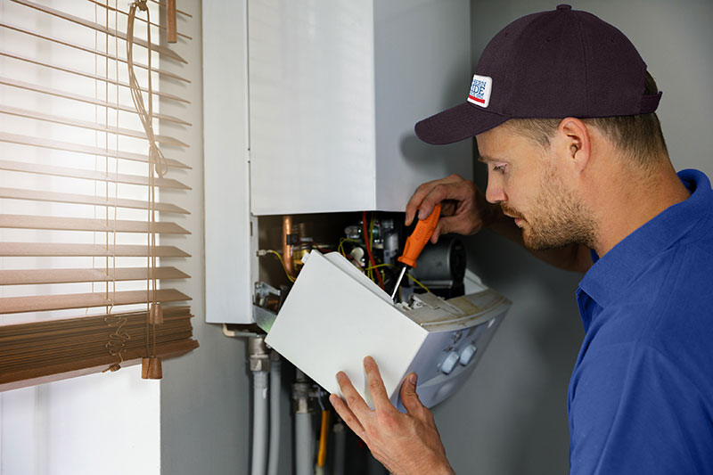 southern pride services hvac technician fixing heating